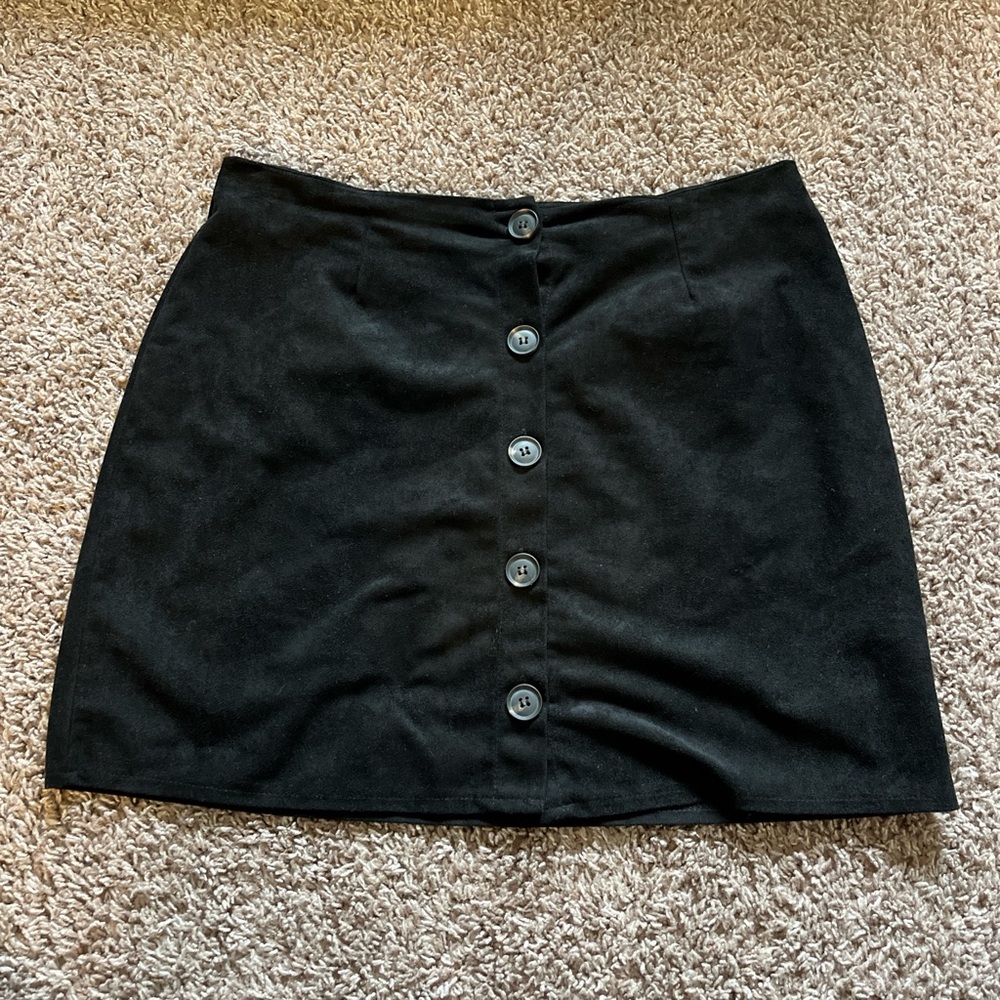 Black skirt with white buttons down the front